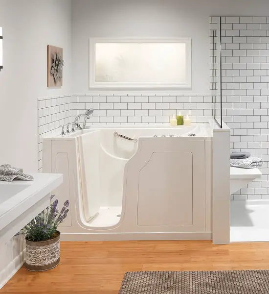 Modern bathroom with white walk-in tub and subway tile