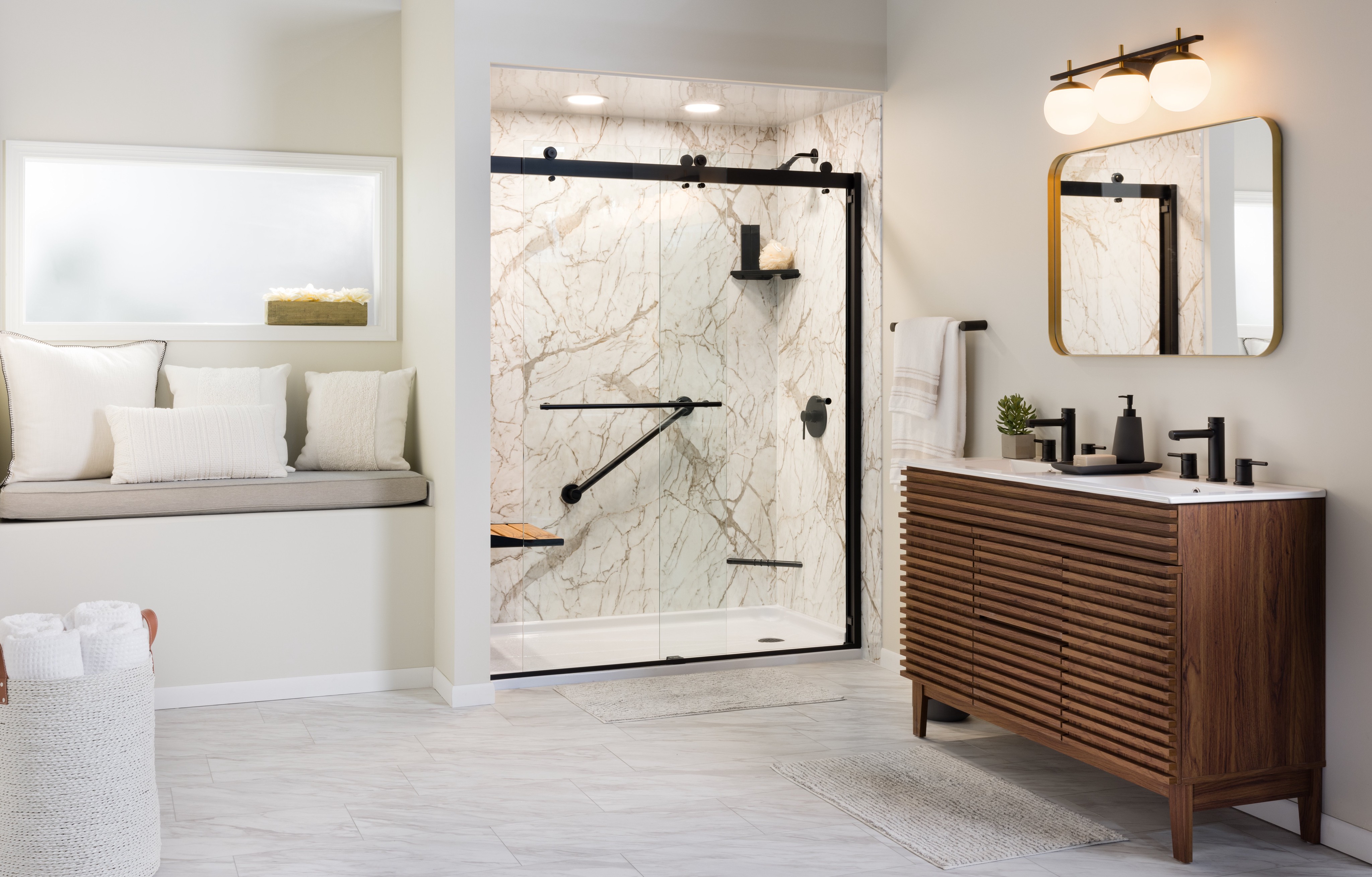 Modern bathroom with marble shower, black fixtures, and premium Bath Planet accessories