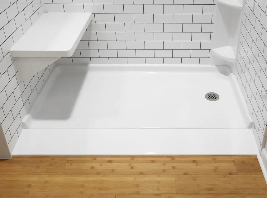 Ultra low shower base with fold-down seat and corner shelf on white subway tile walls